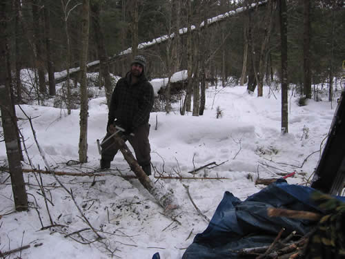 Mark cuts up some firewood.