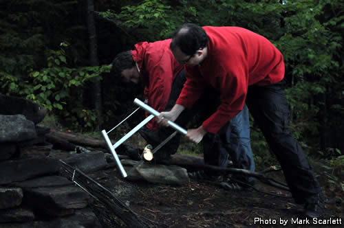 Julian and Jeff cut some wet firewood.