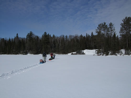 The crew snowshoeing out of Pinetree Lake.