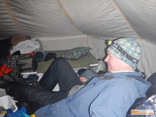 Glen stretches out in the hot tent.