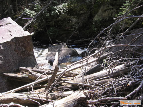 Rocks and debris at the drop.