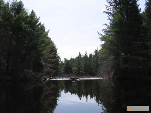 Smooth water before the ripples start.