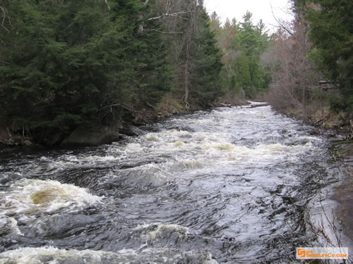 Stretch of fast water and froth.